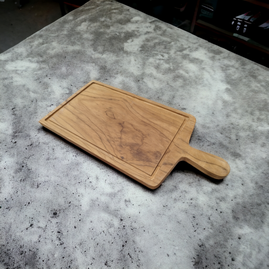 Cutting board with handle